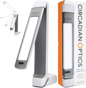 Circadian Optics Lumos 2.0 light therapy lamp folded on desk