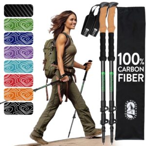 Hiker using trekking poles on rocky mountain trail