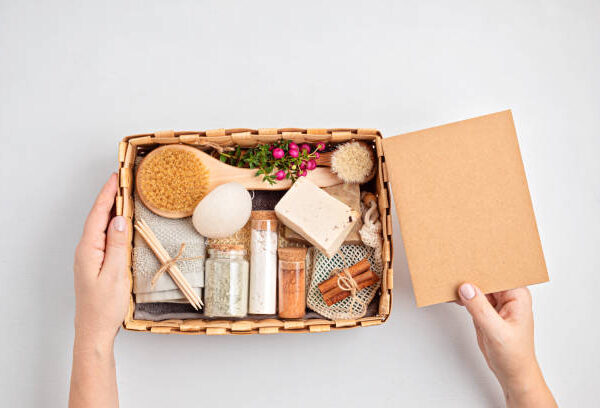 Preparing self care package, seasonal gift box with plastic free zero waste cosmetics products. Personalized eco friendly basket for family and friends for thankgiving, christmas, mothers day