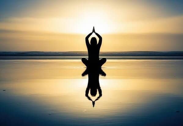 Silhouette Of A Woman Meditating At Sunset Yoga Spirituality Wellness And Mindfulness By The Water Photo